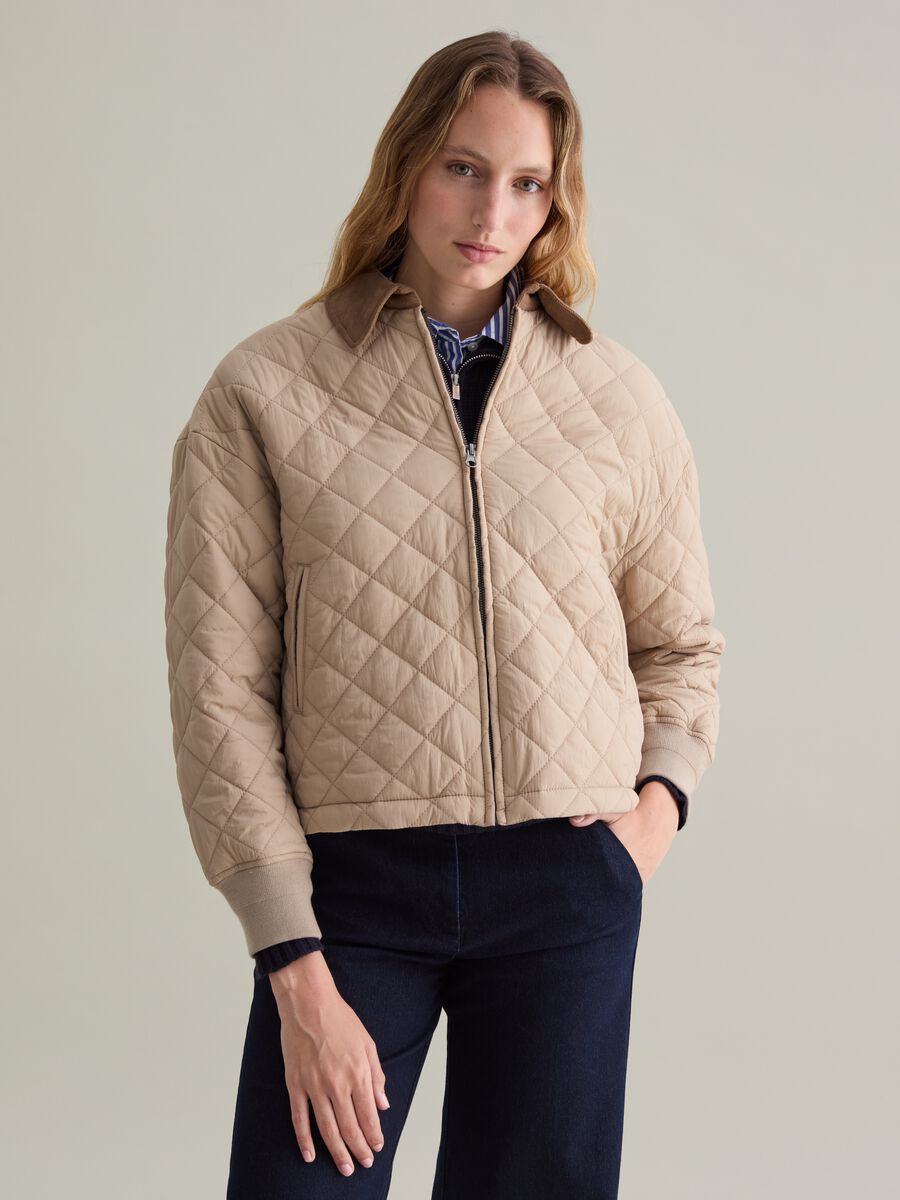 Short quilted jacket with collar in corduroy_1