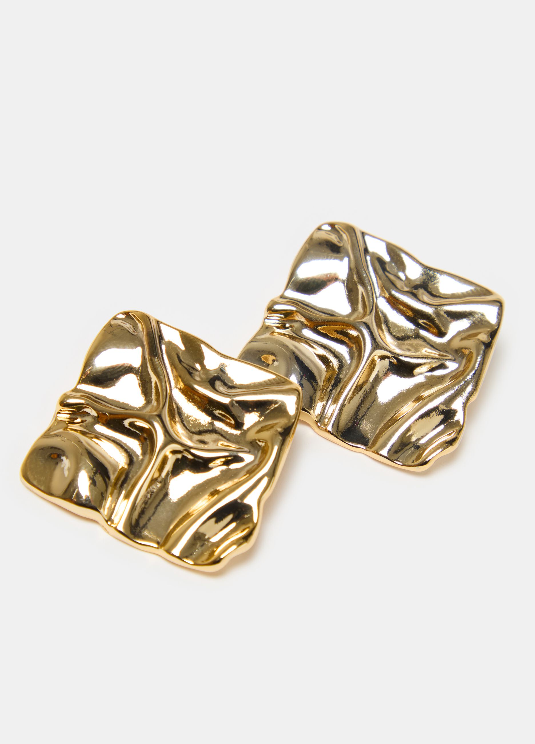 Earrings with raised design