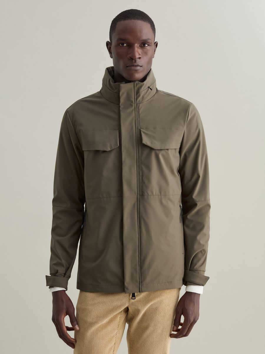 Short jacket in technical fabric with high neck_1