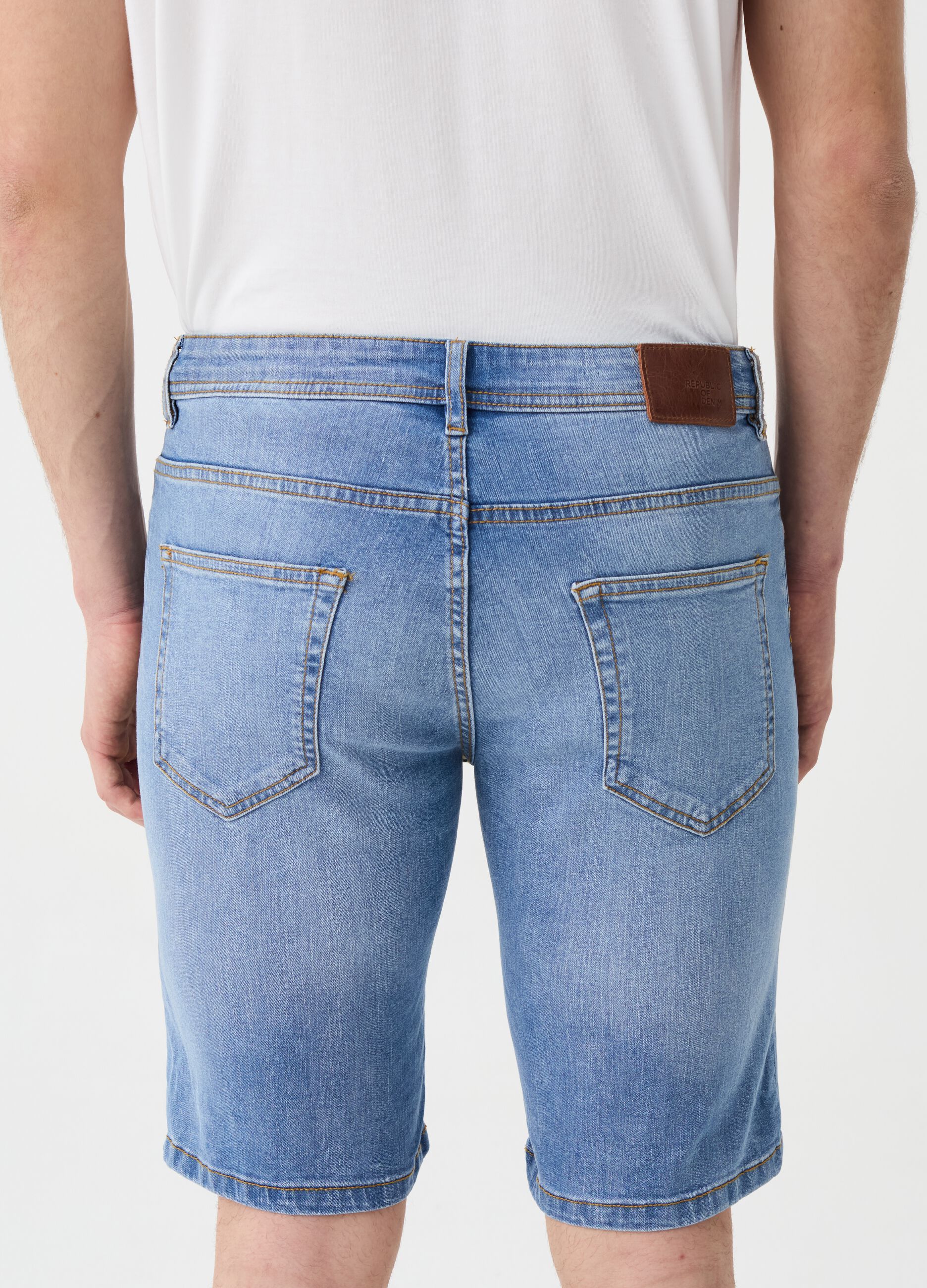 Slim-fit Bermuda shorts in denim with RE-UP print