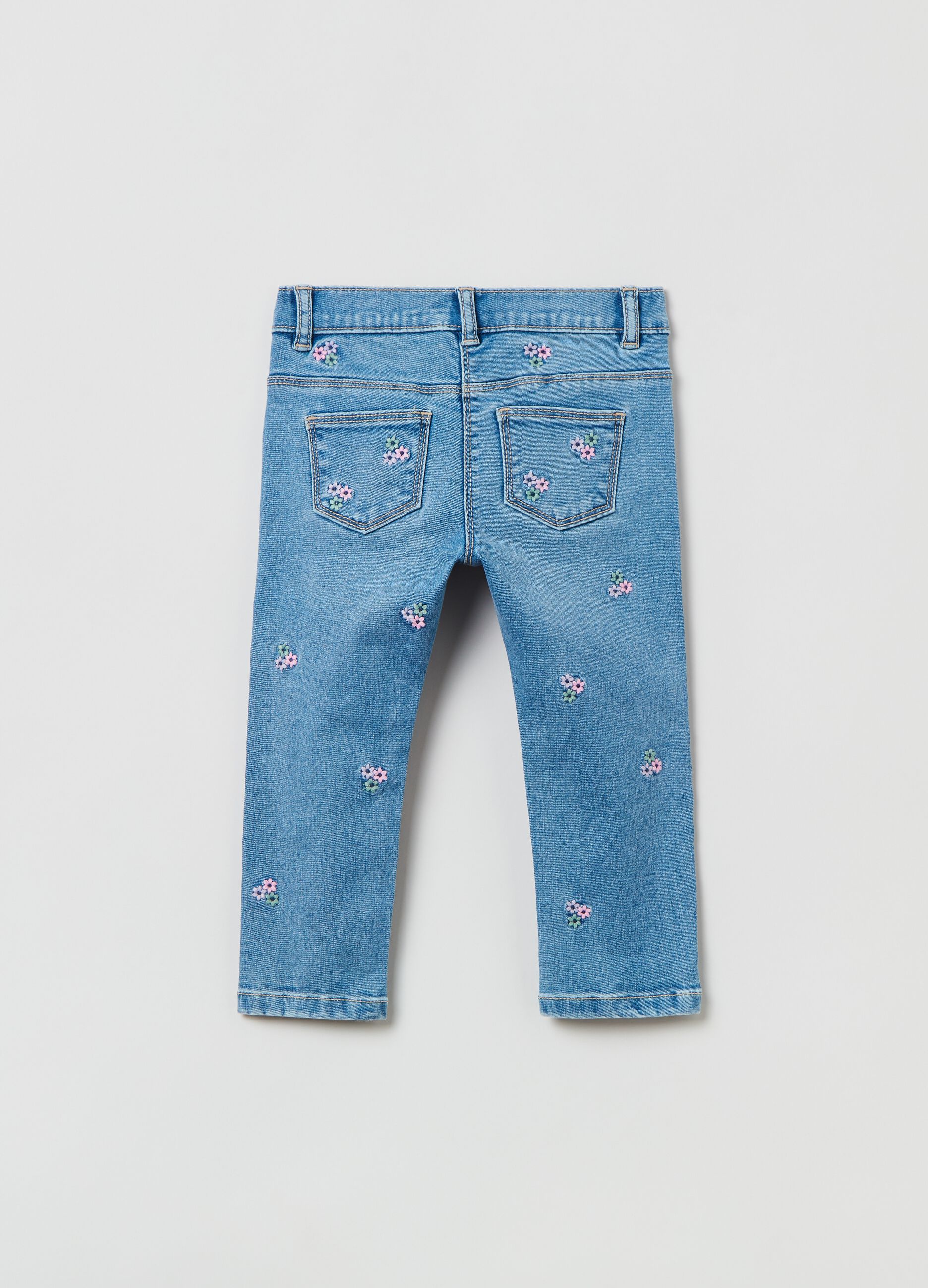 Five-pocket jeans with embroidered floral motif