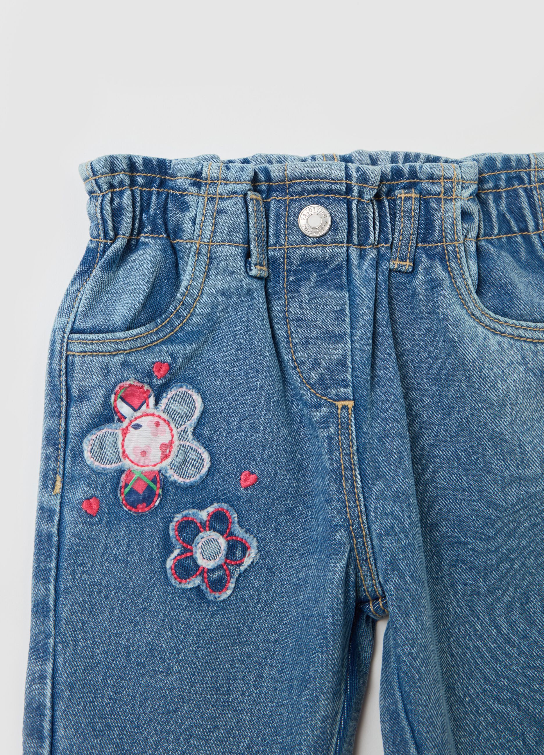 Jeans with pockets and flowers patch