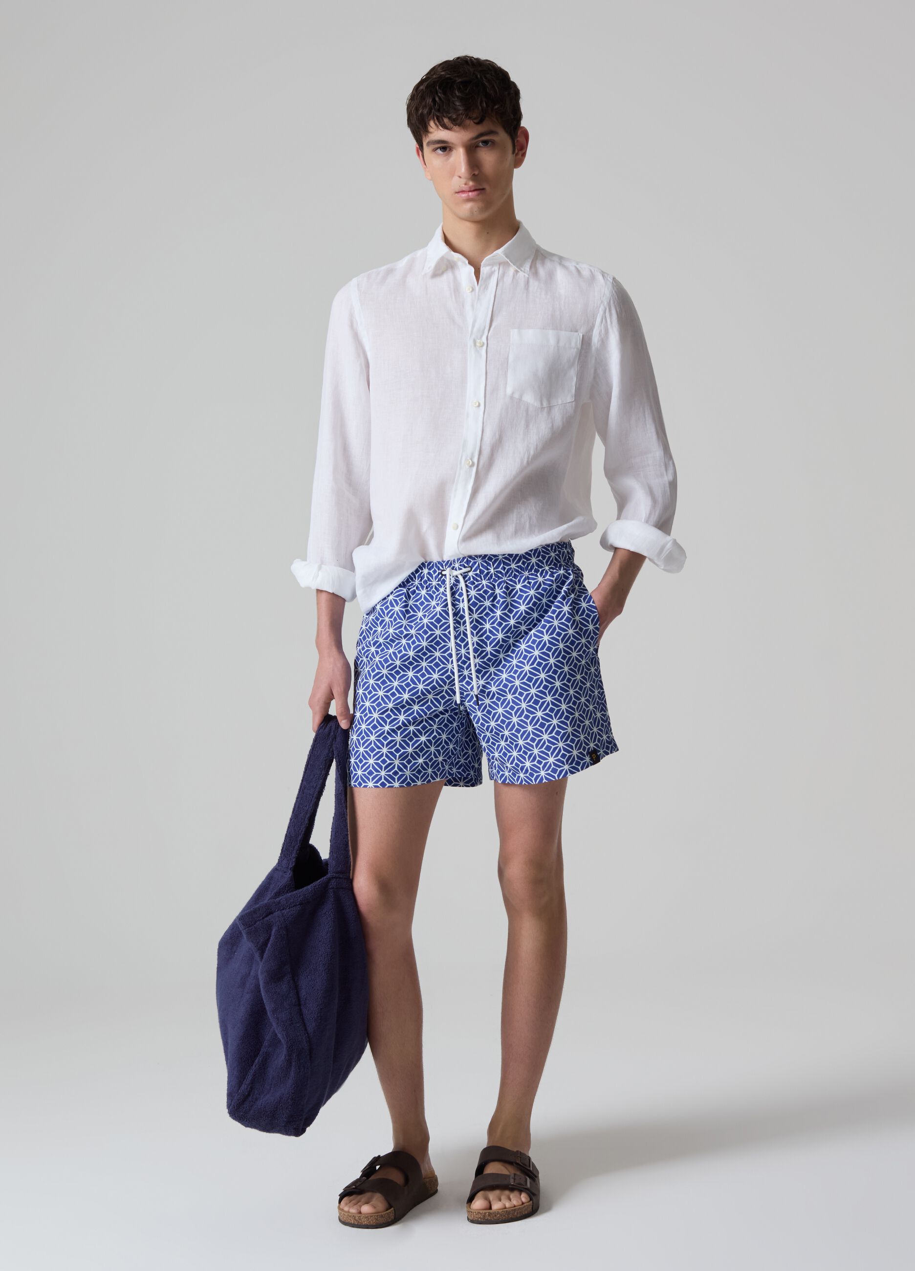 Bermuda swim shorts with geometric print