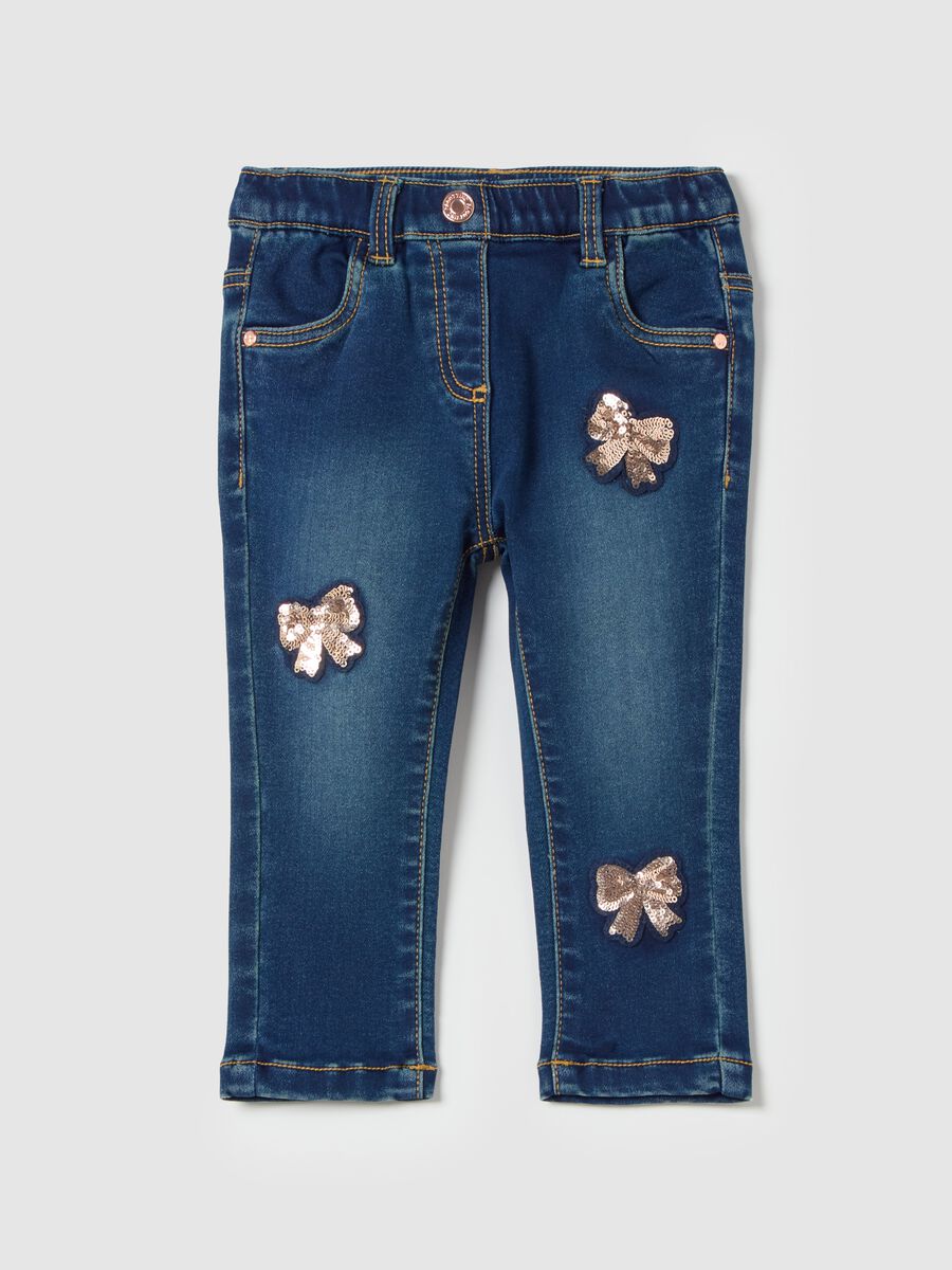 Slim-fit jeans with sequinned bows_0