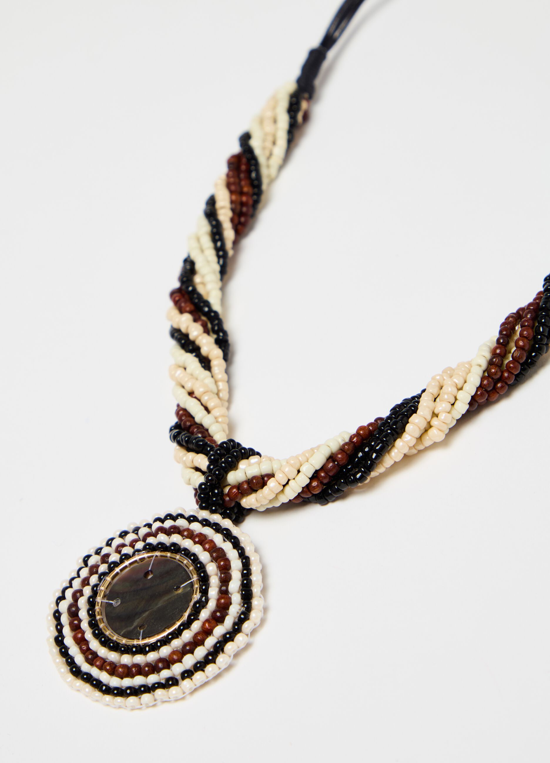 Necklace with twisted beads and pendant
