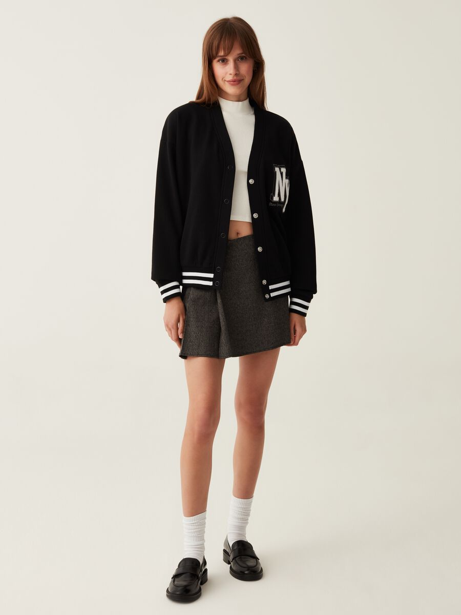 Varsity cardigan in plush with college emblem_1