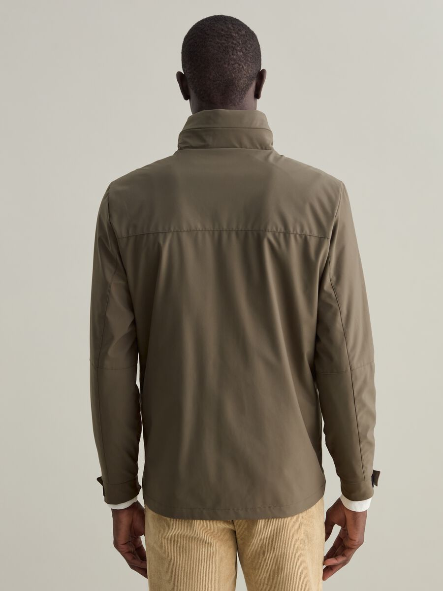 Short jacket in technical fabric with high neck_3