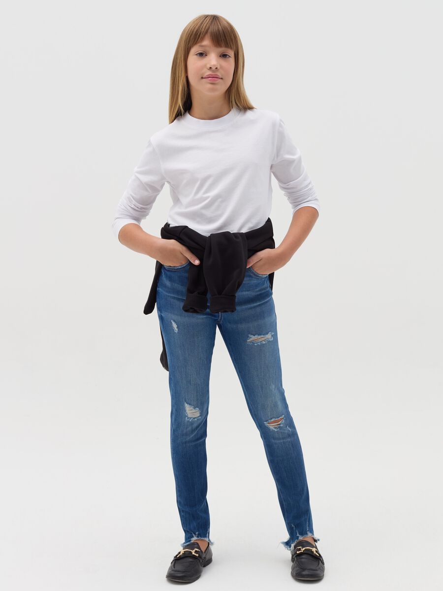 Slim-fit destroyed jeans with five pockets_0