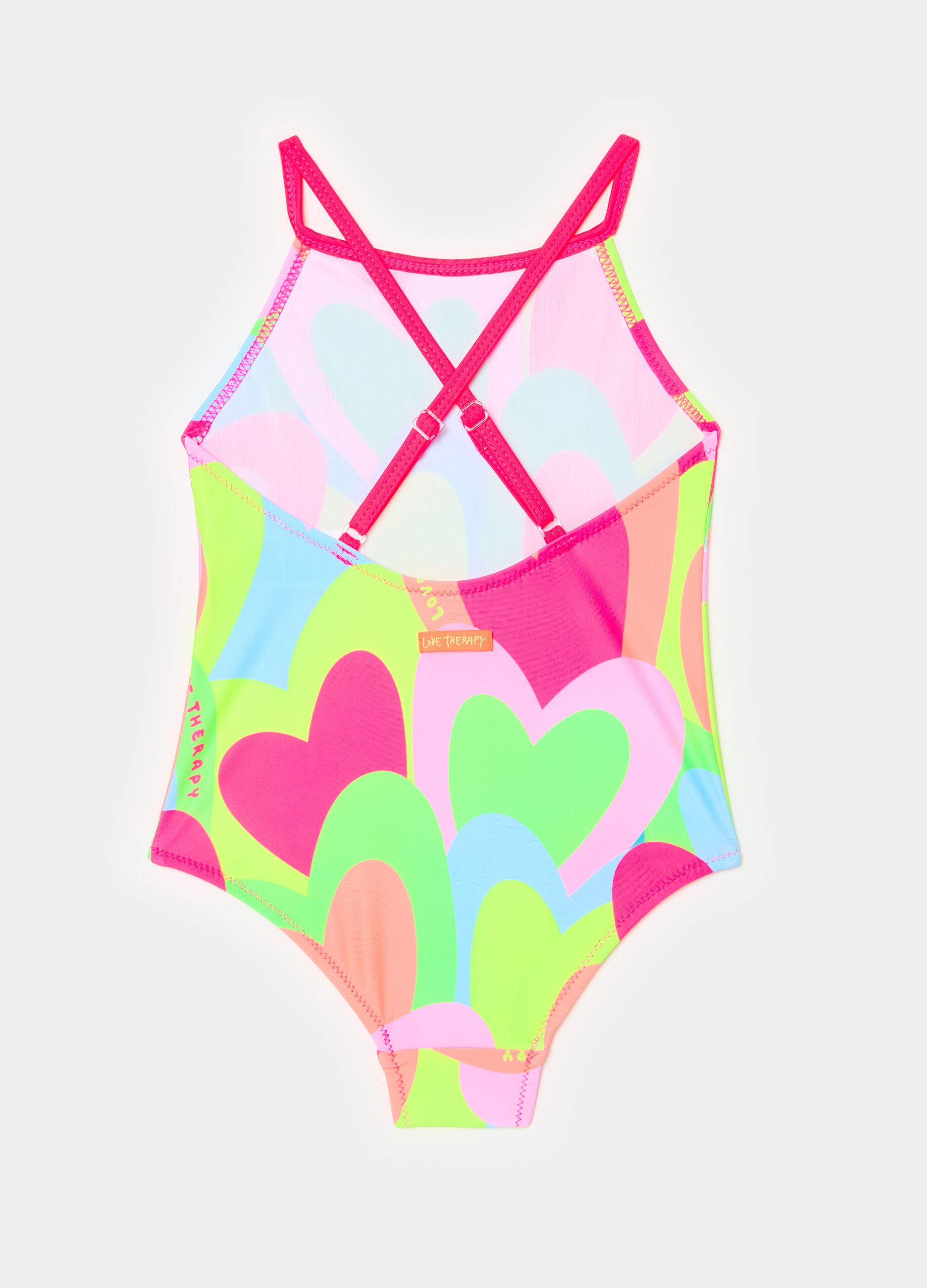 One-piece swimsuit with multicoloured hearts print