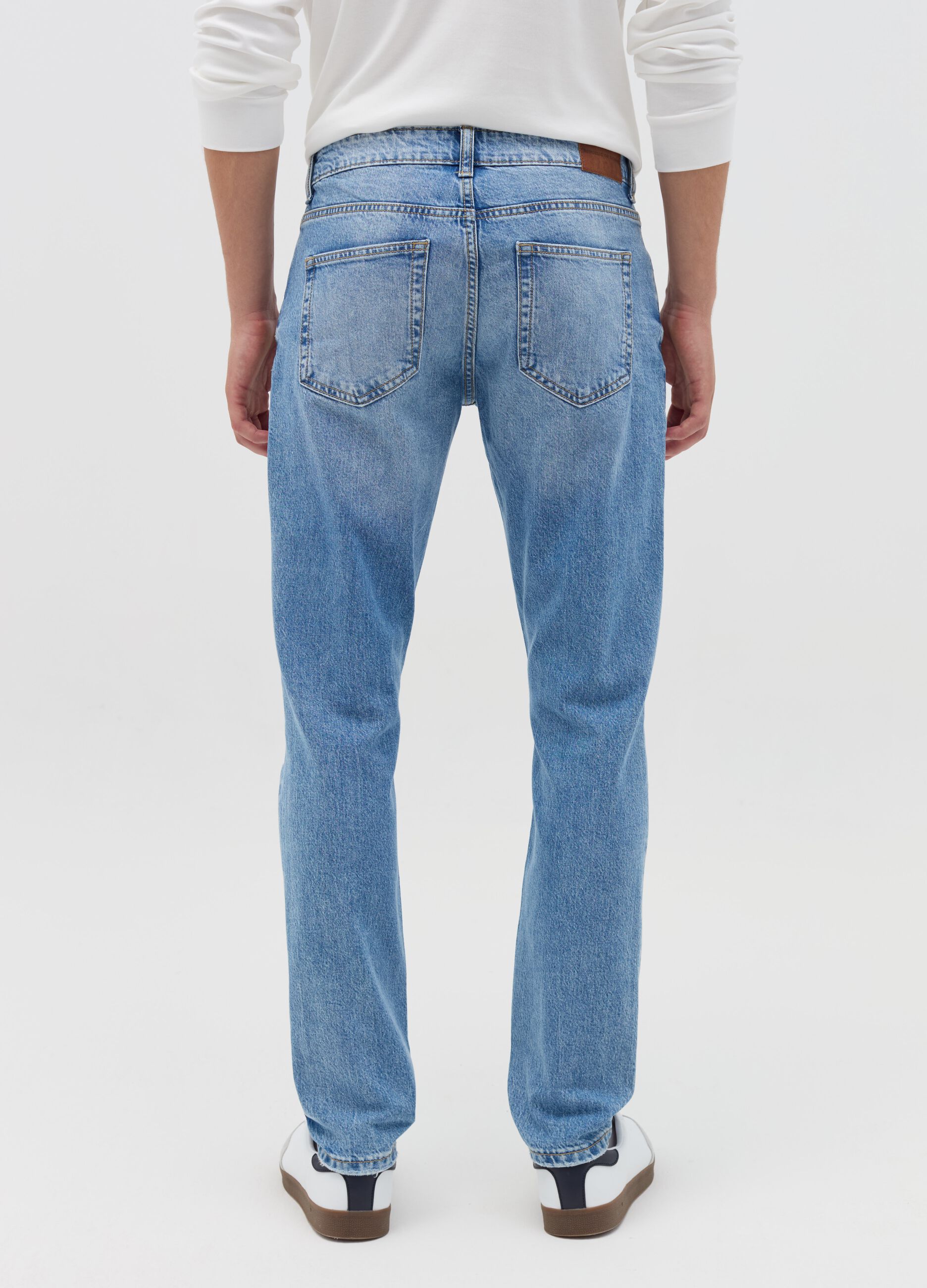 Slim-fit acid-wash jeans with abrasions