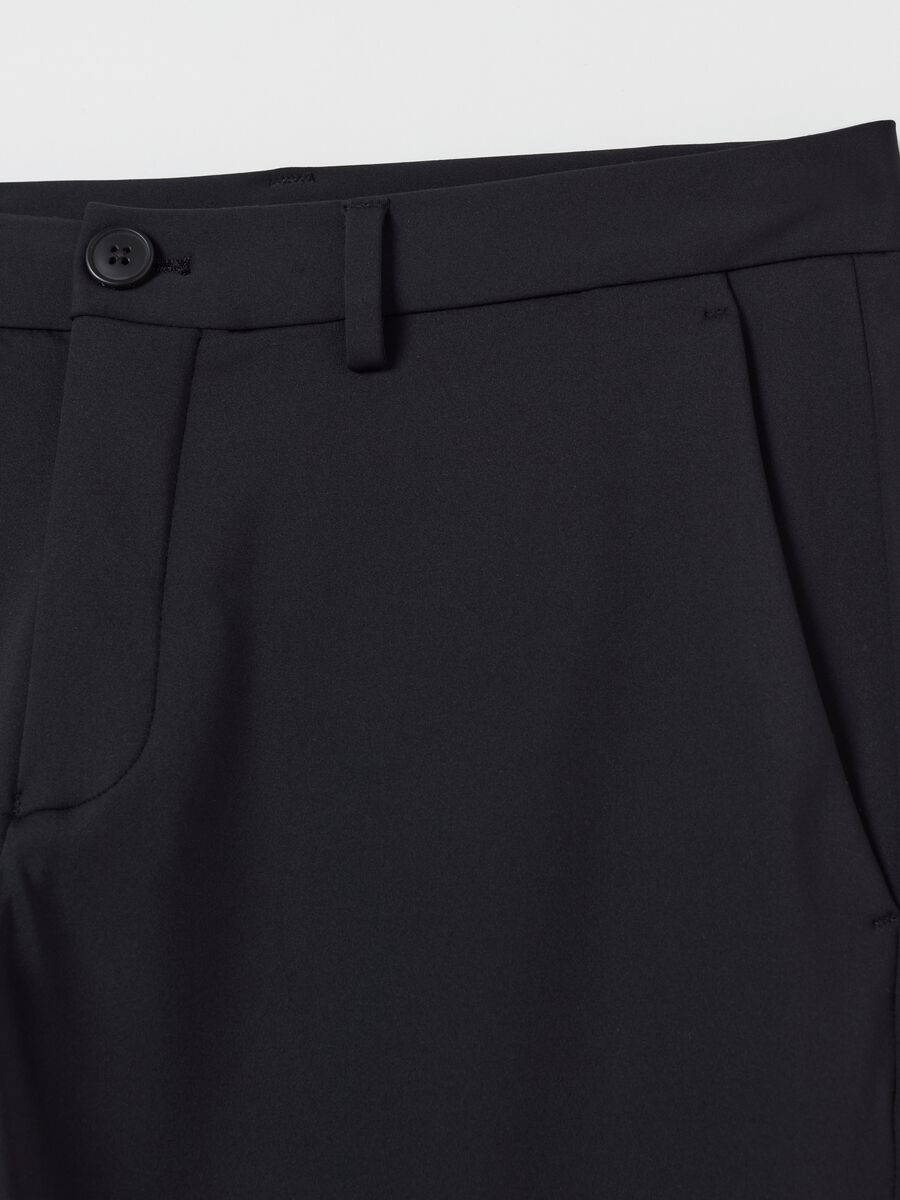 Contemporary chino trousers in technical fabric_5