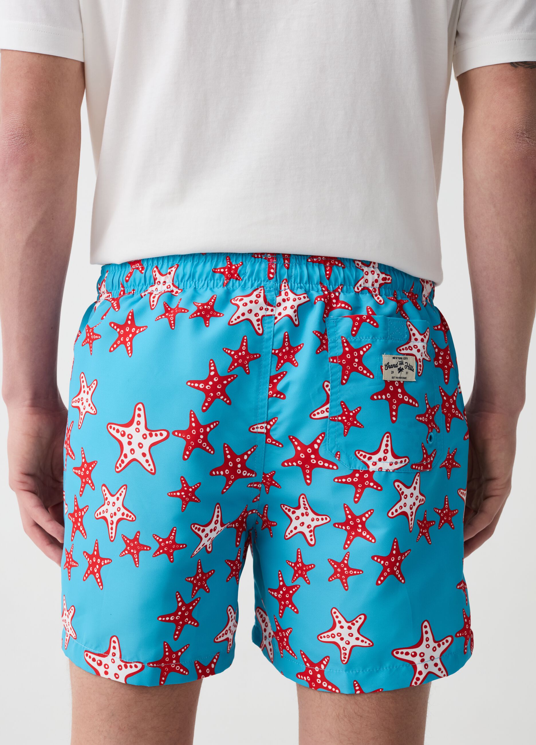 Swimming trunks with starfish print