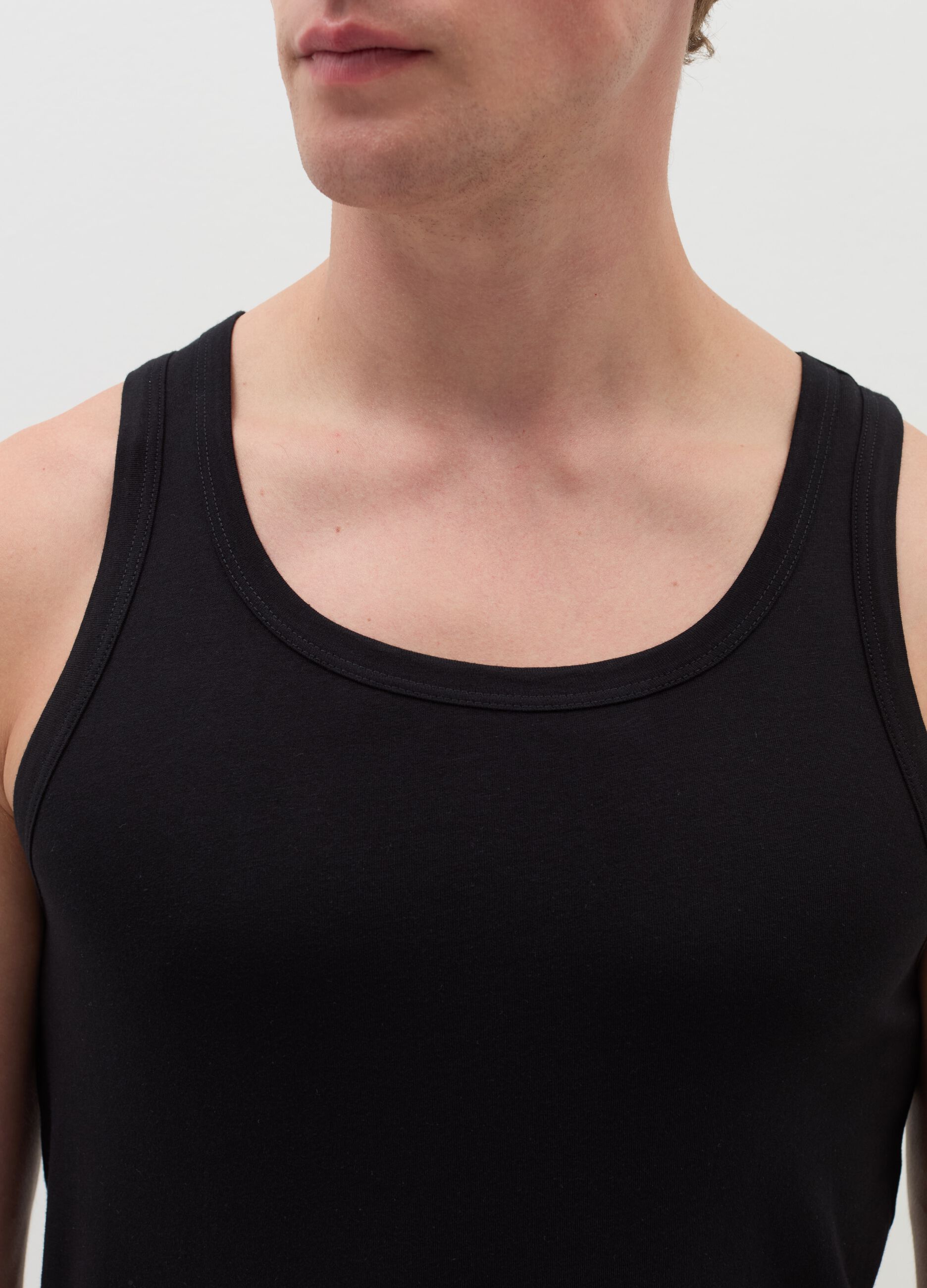 Three-pack racerback vests in organic cotton