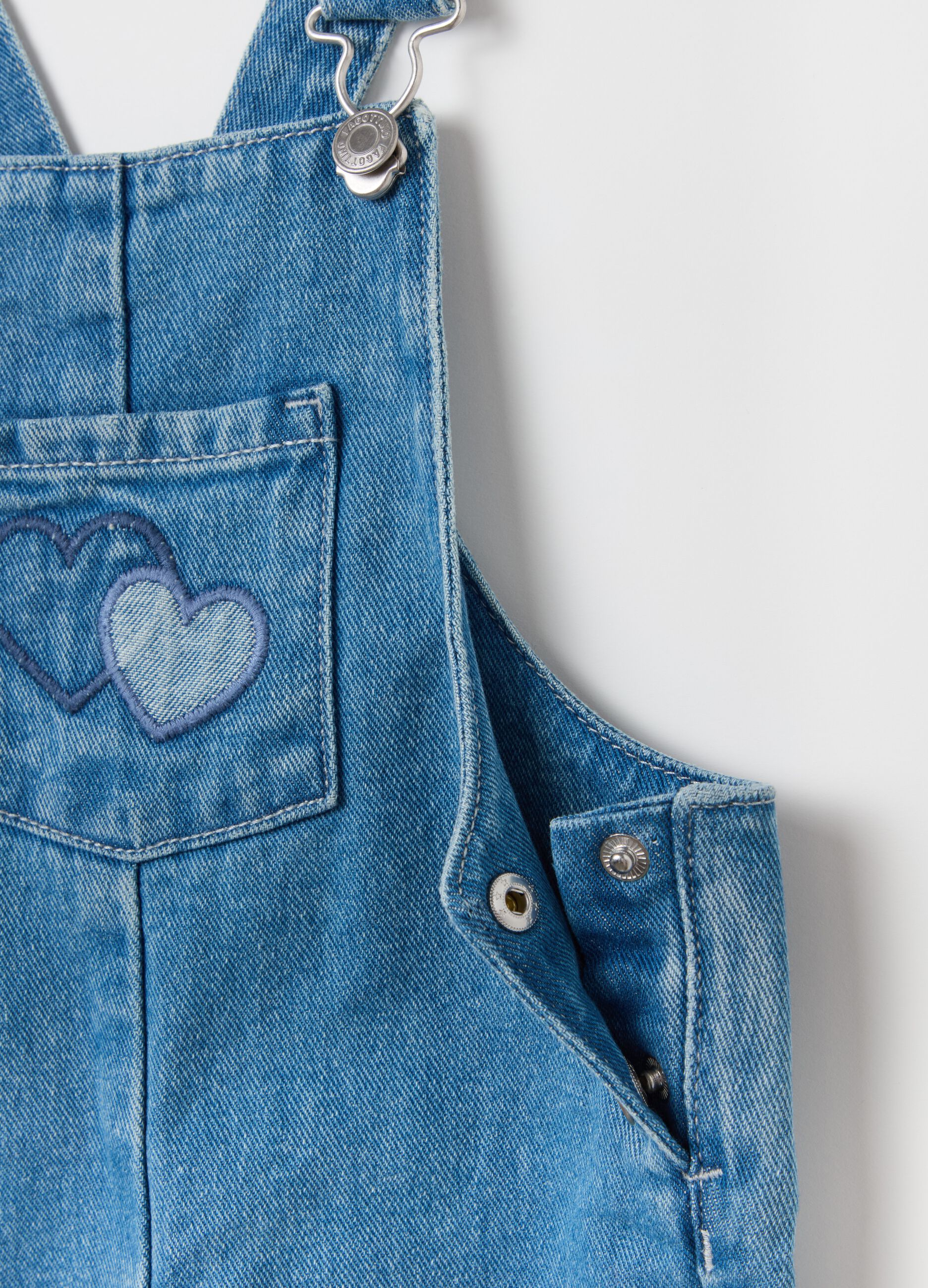 Denim dungarees with hearts embroidery and patch