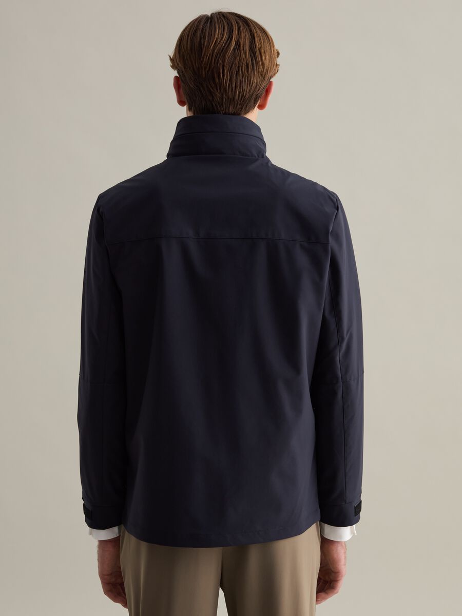 Short jacket in technical fabric with high neck_2