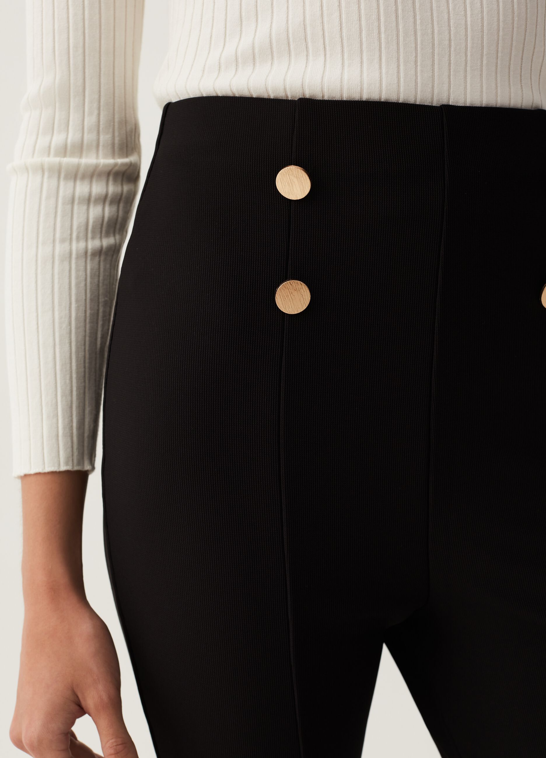 Flare-fit trousers with golden buttons