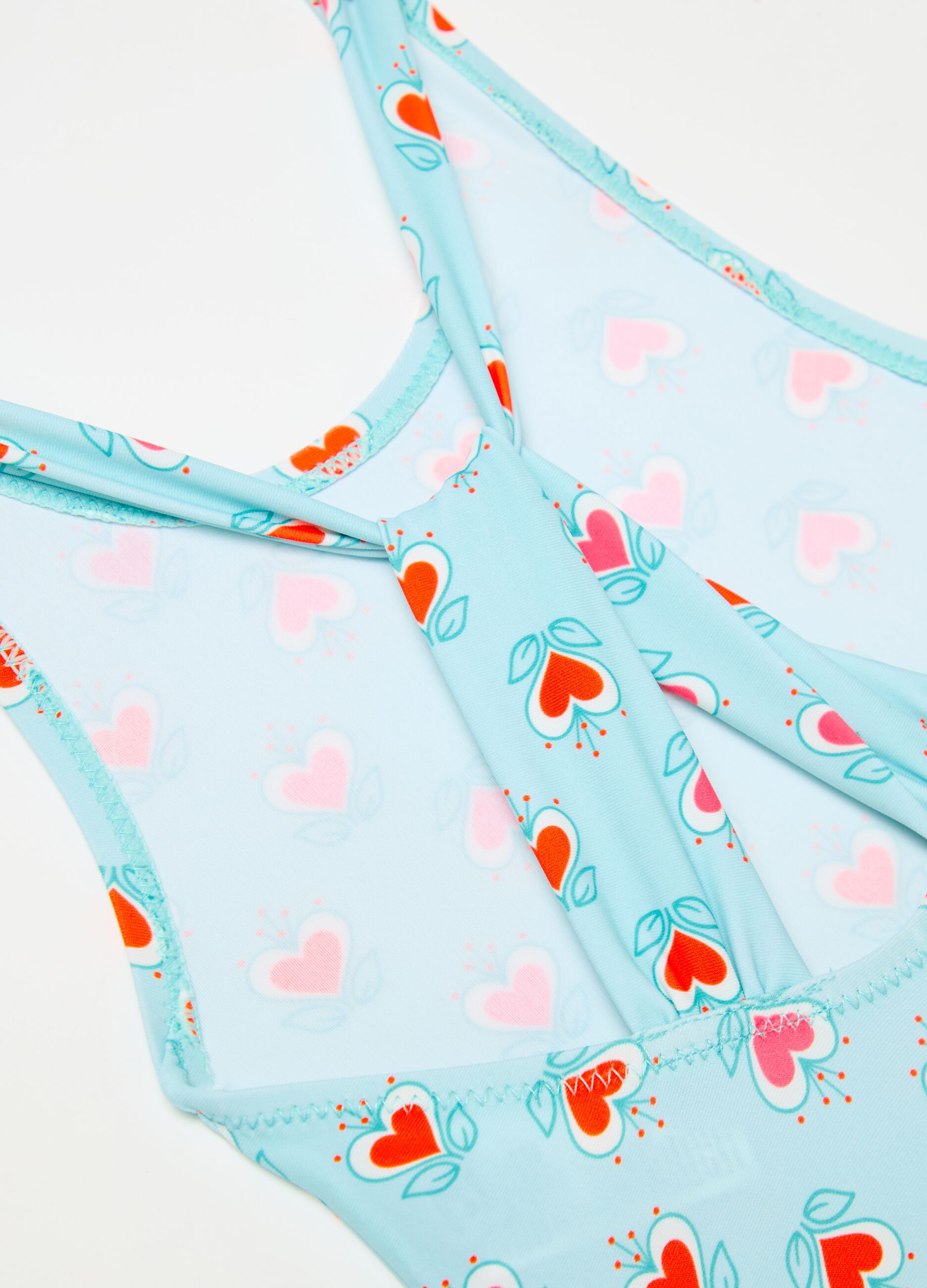 One-piece swimsuit with floral hearts print