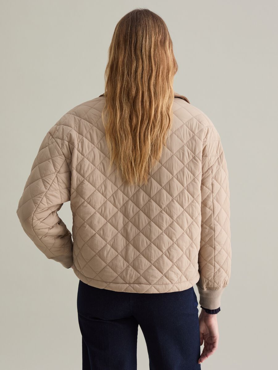 Short quilted jacket with collar in corduroy_2