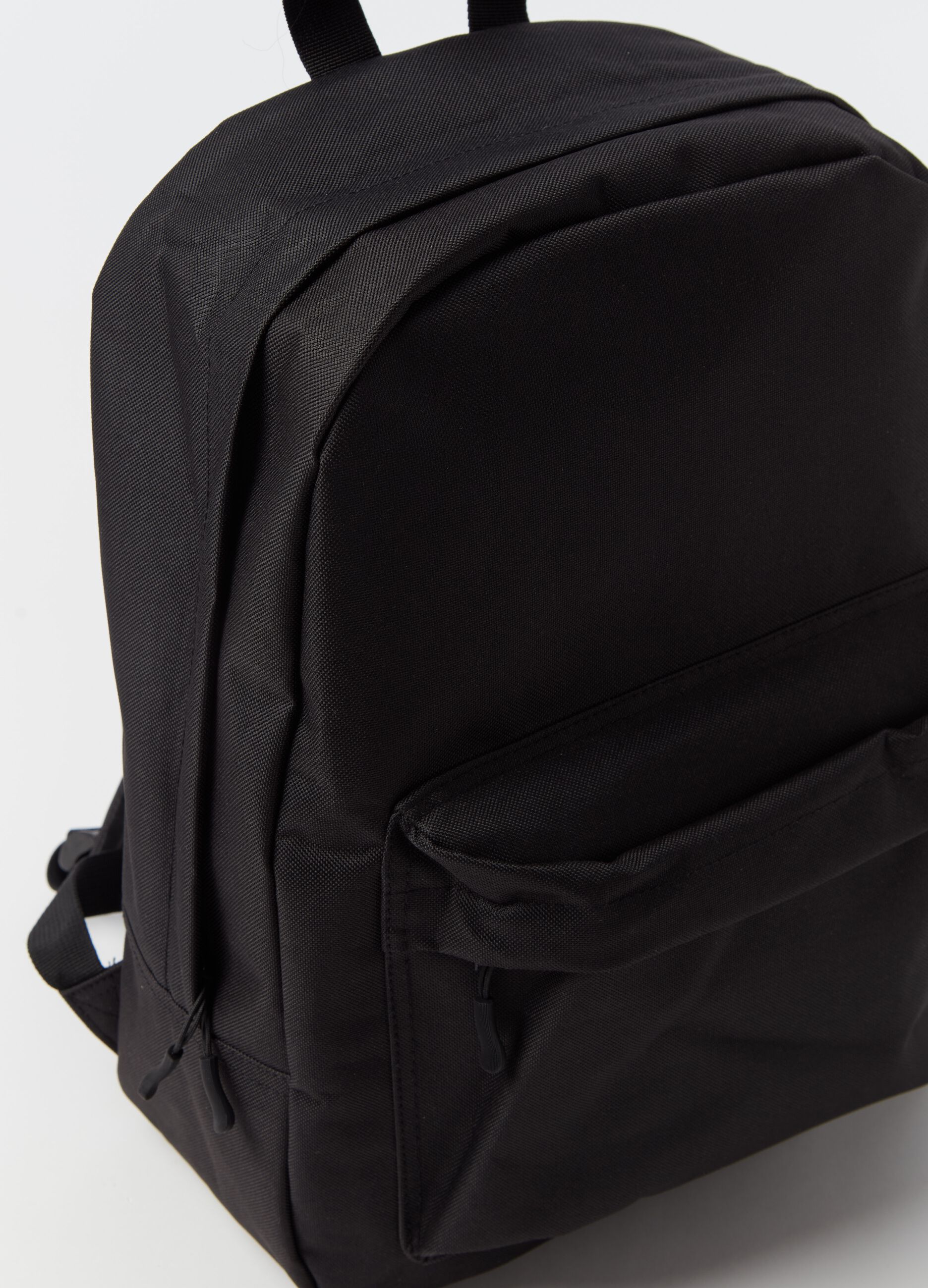 Oval backpack with outside pocket