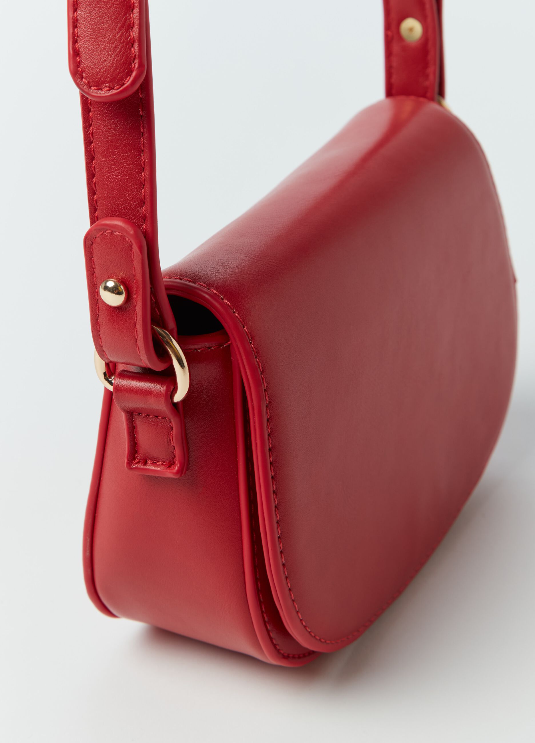 Rounded bag with shoulder strap