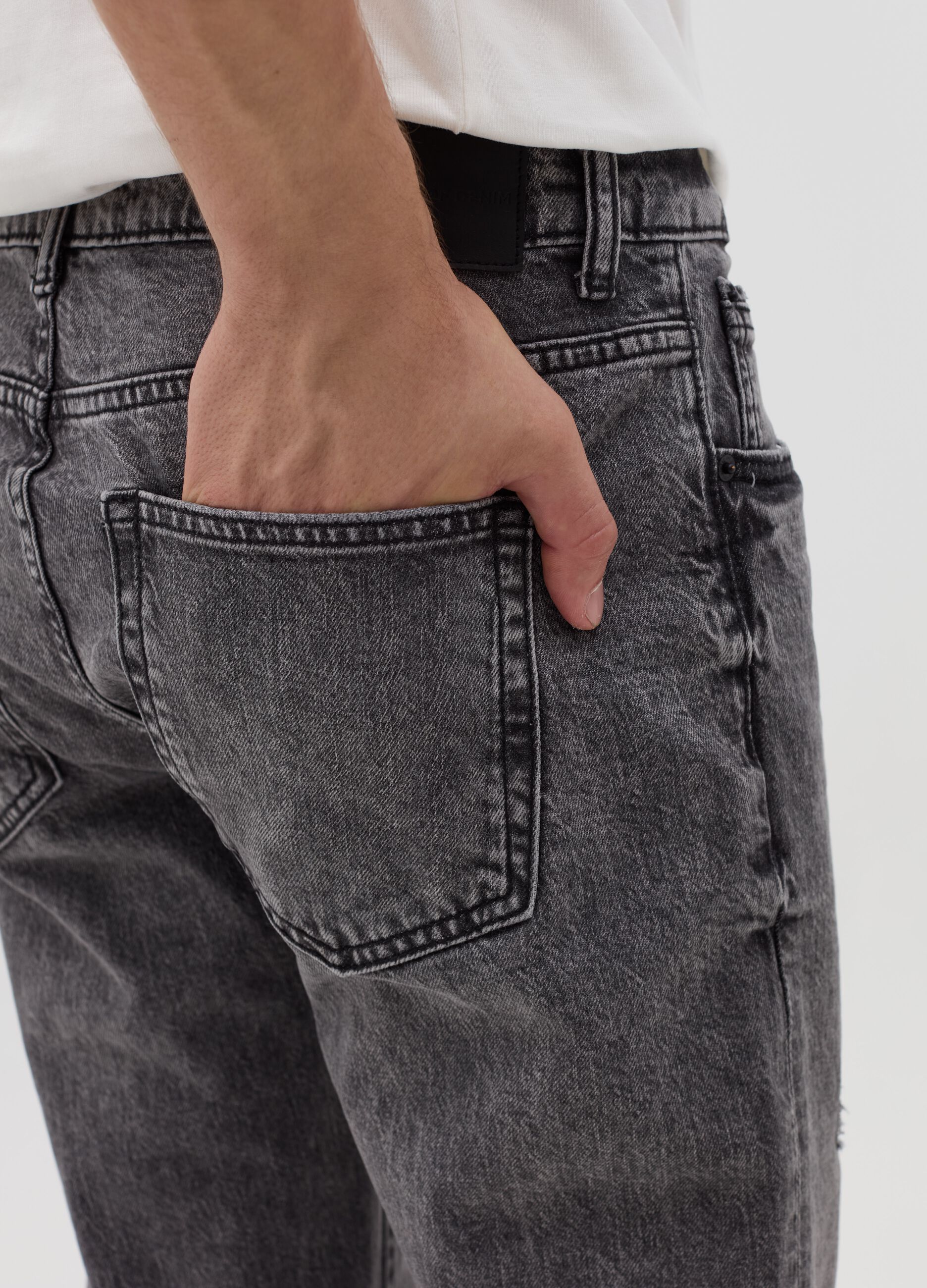 Slim-fit acid-wash jeans with abrasions