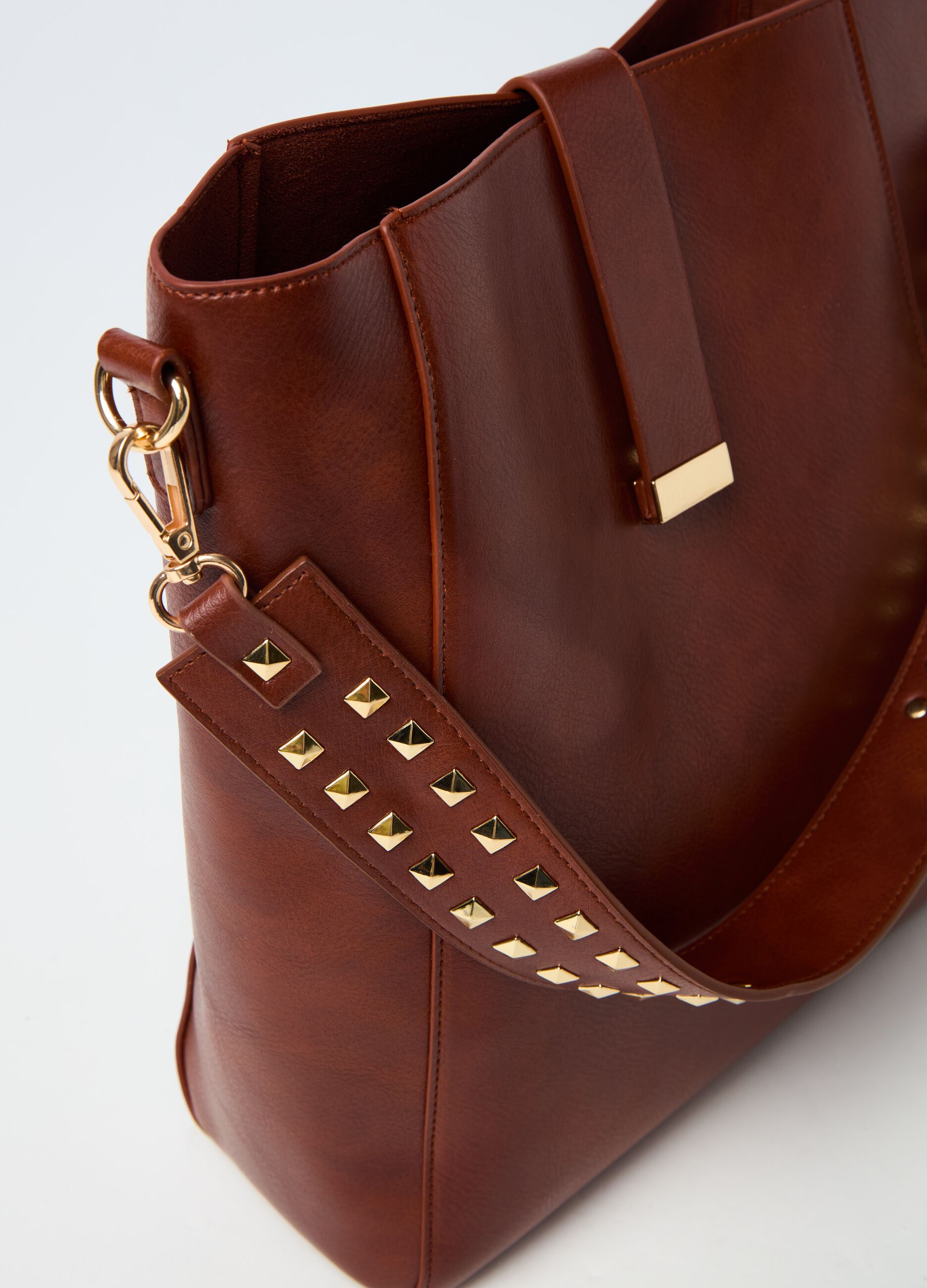 Bucket bag with shoulder strap and studs