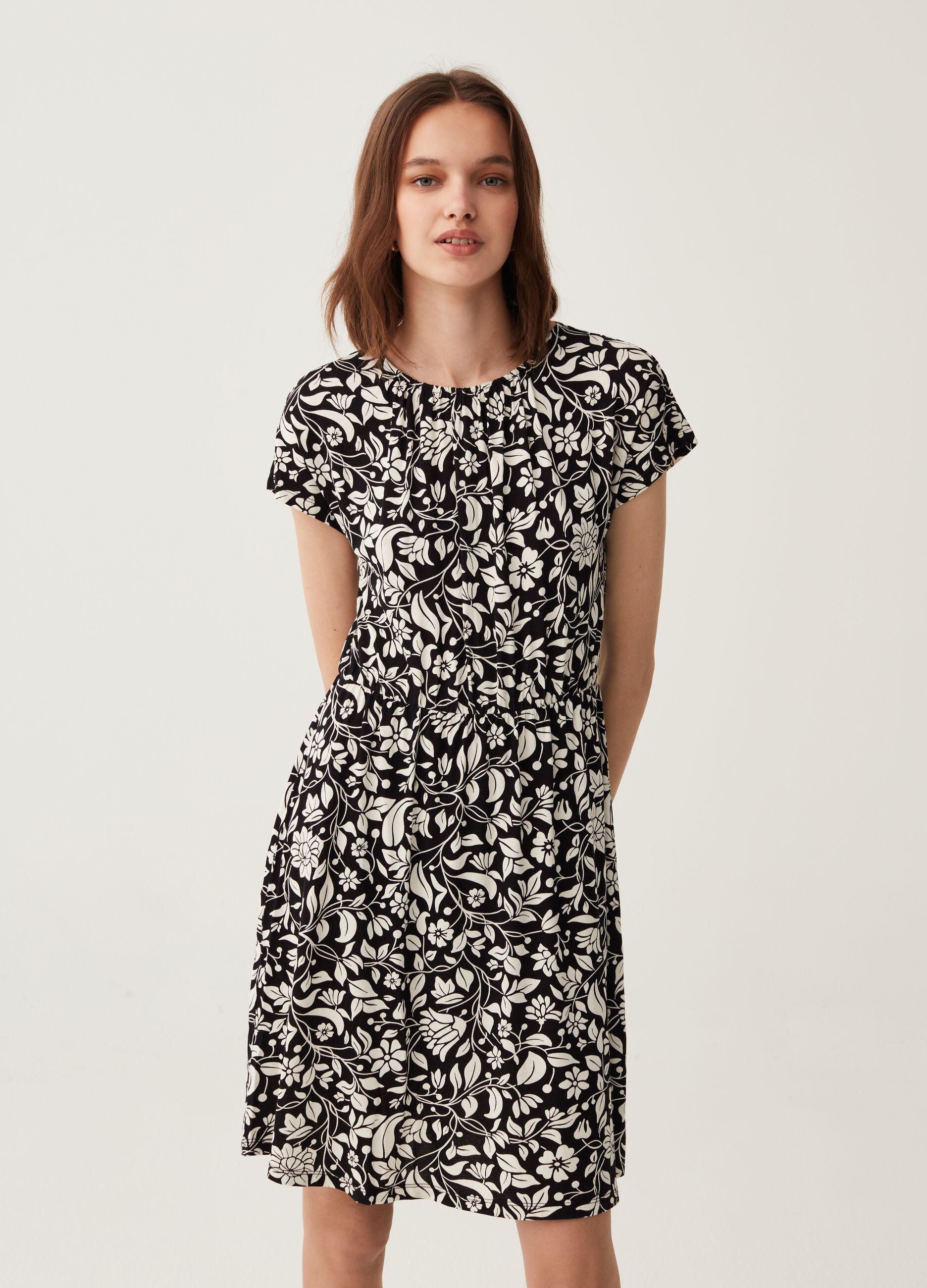 Short dress with floral pattern.