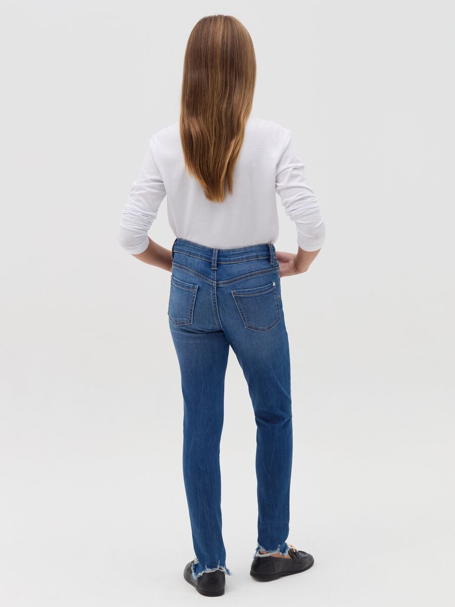 Slim-fit destroyed jeans with five pockets_1