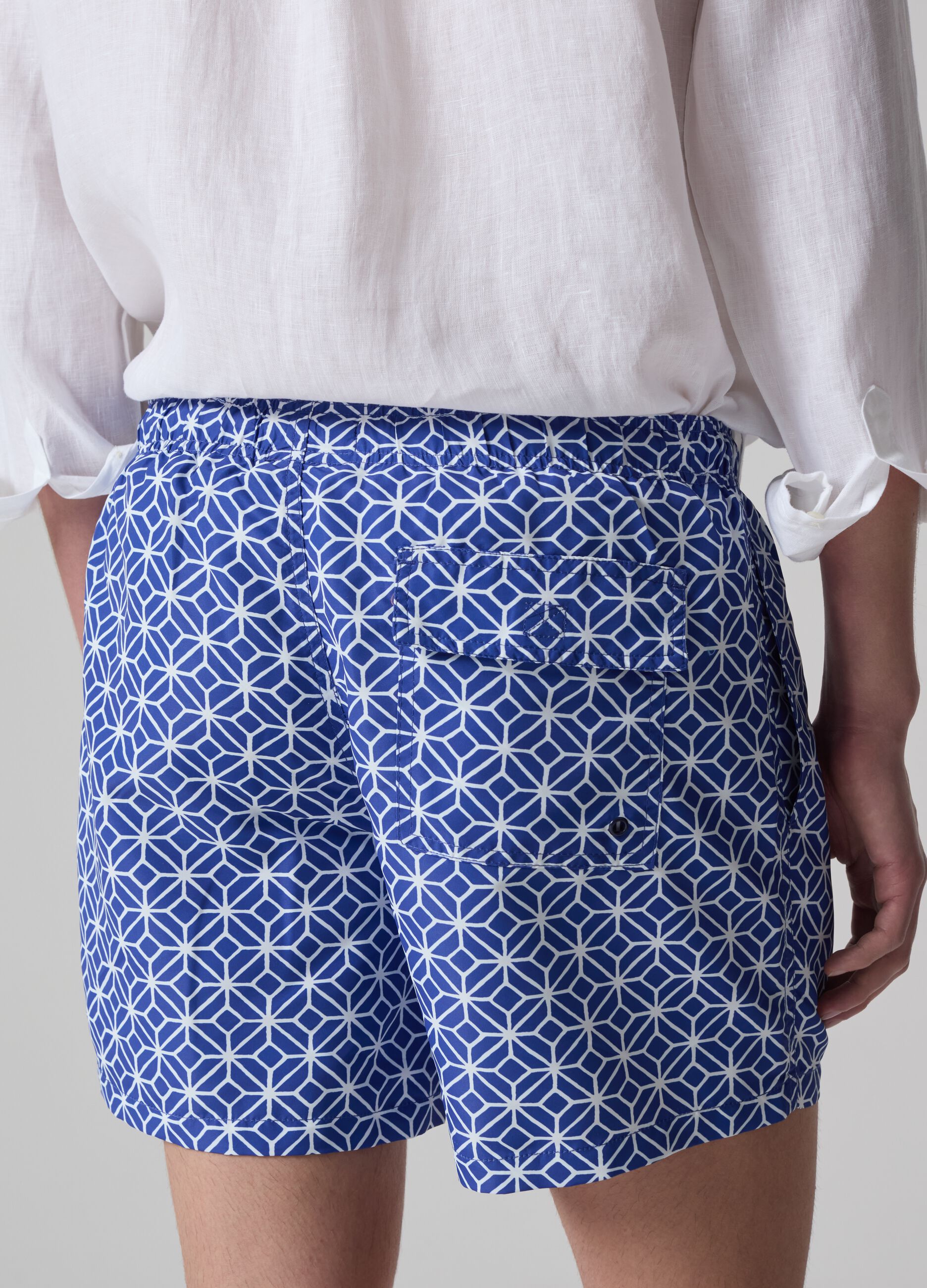 Bermuda swim shorts with geometric print