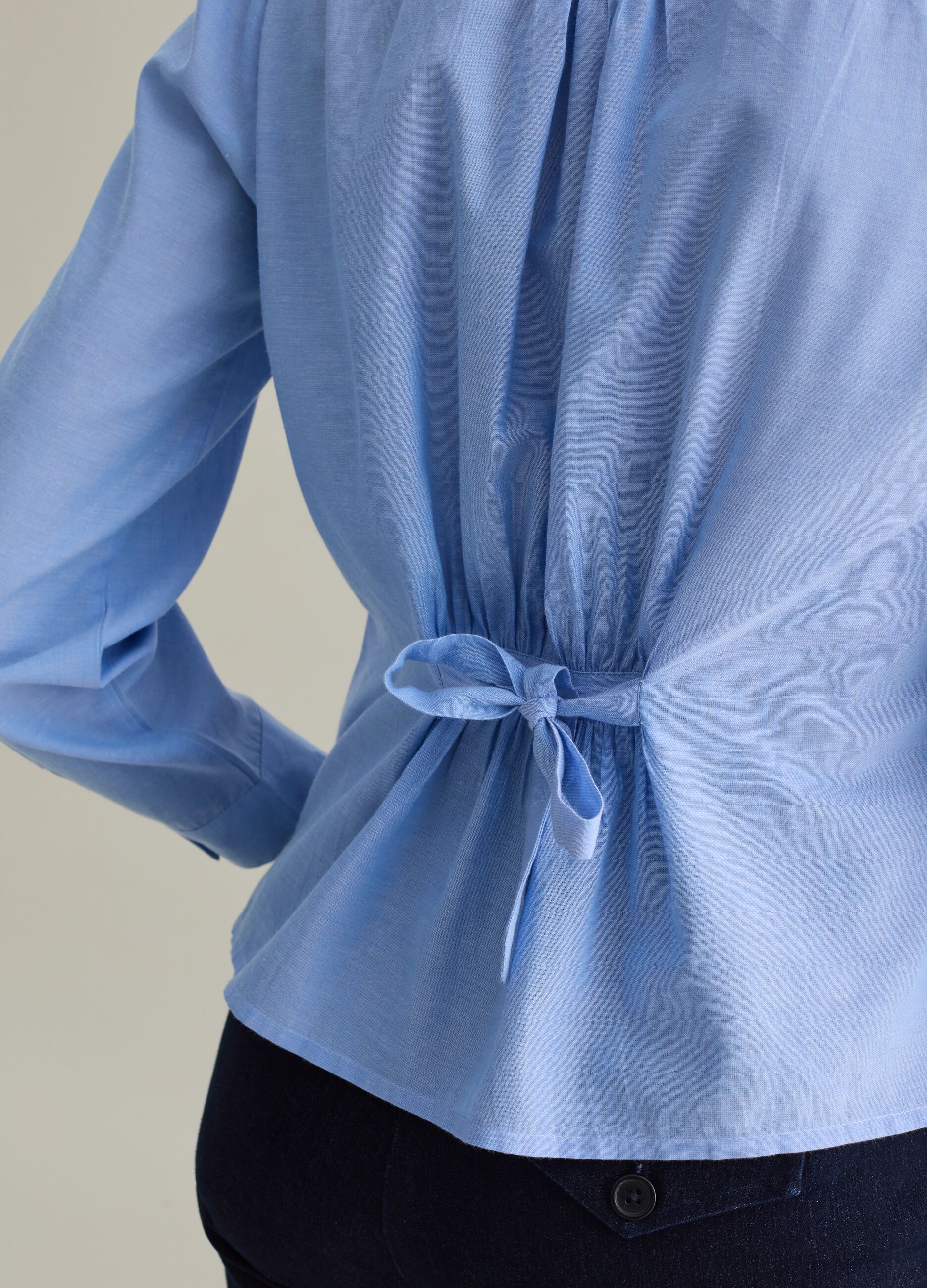 Shirt with pleated detail