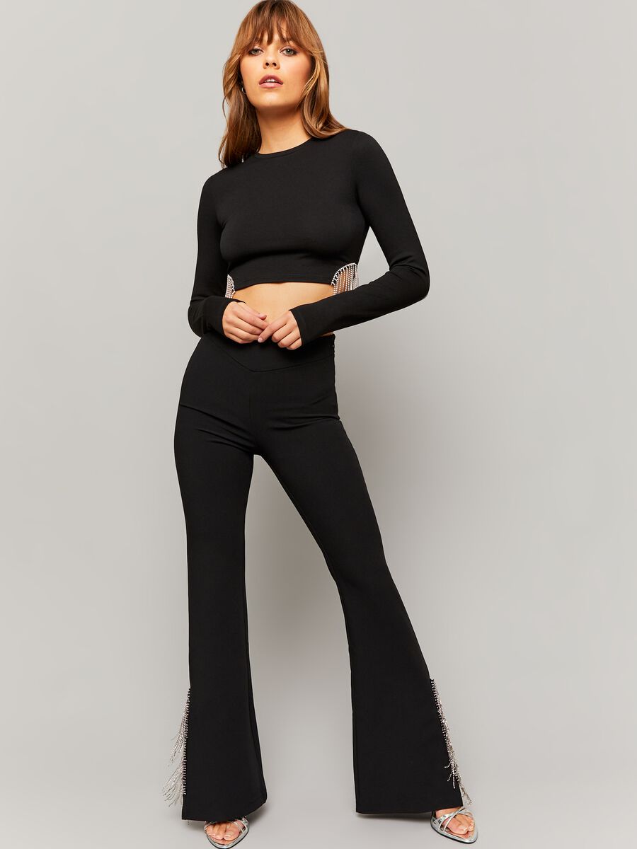 Flare-fit trousers with fringes in diamantés_0