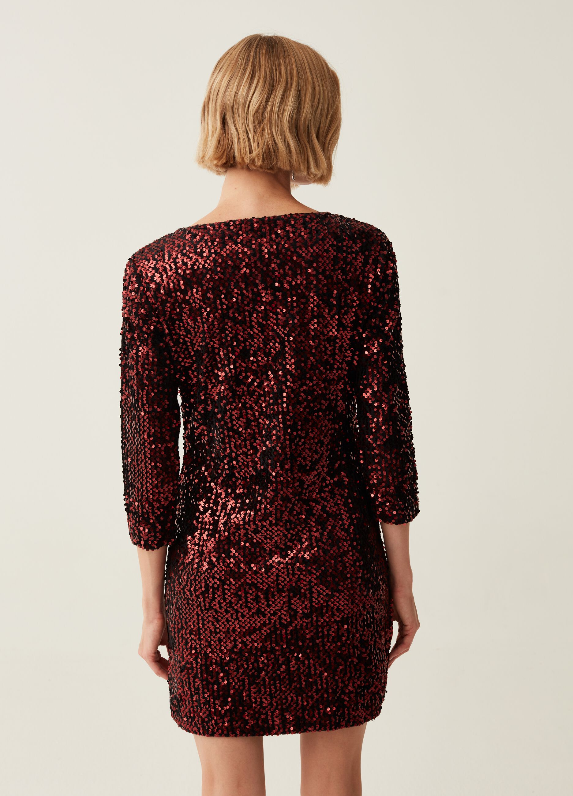 Dress with sequins and three-quarter sleeves