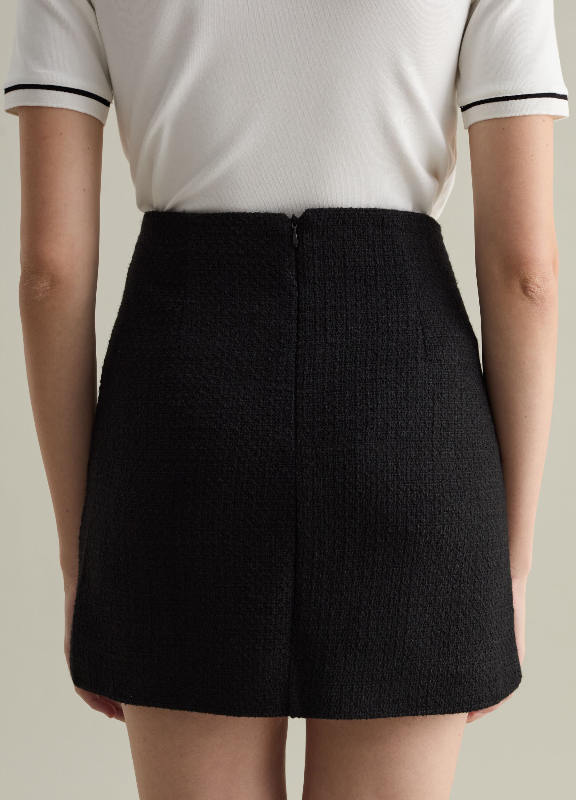 Contemporary tweed miniskirt with buttons