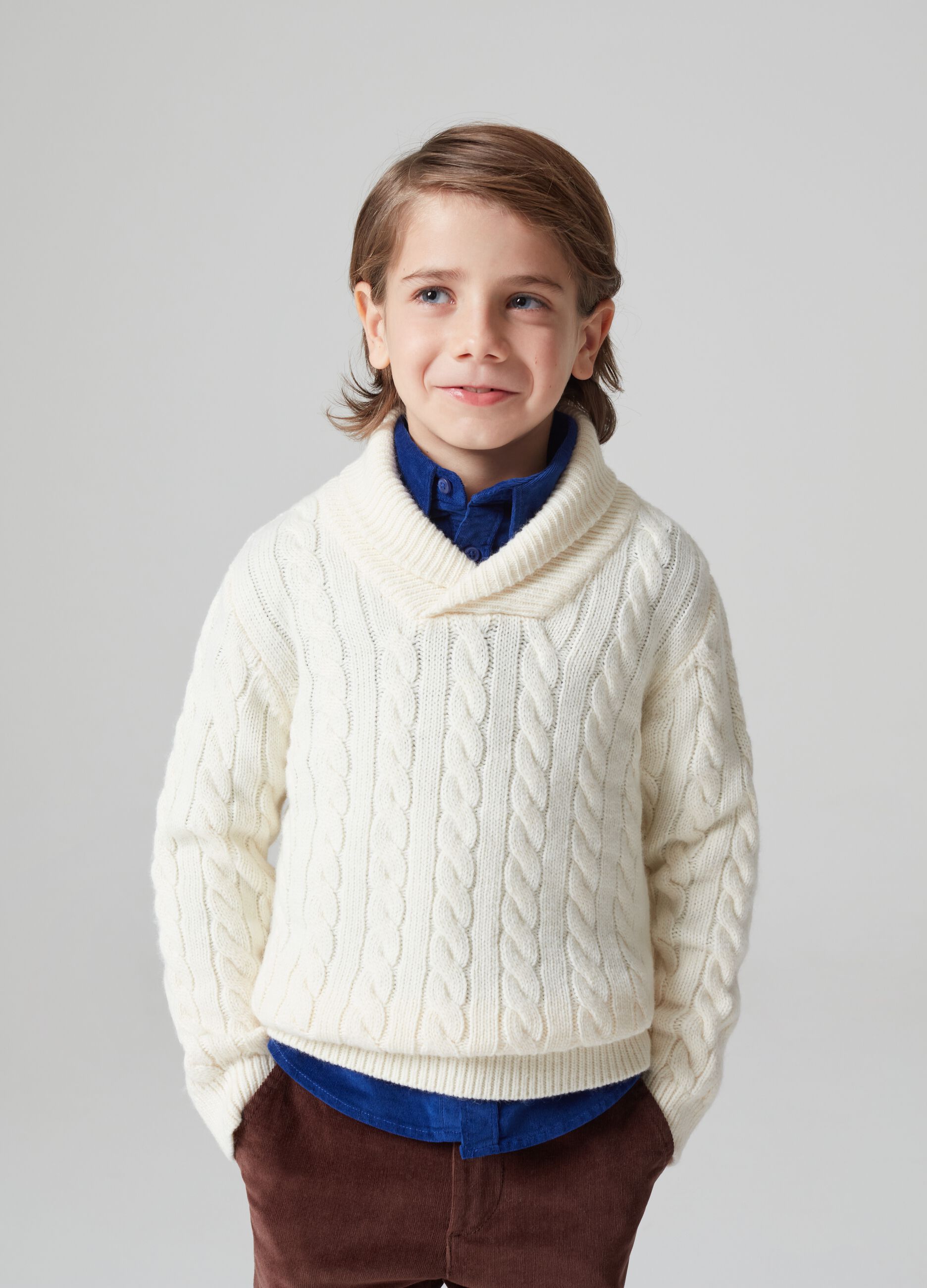 Cable knit pullover with shawl collar.