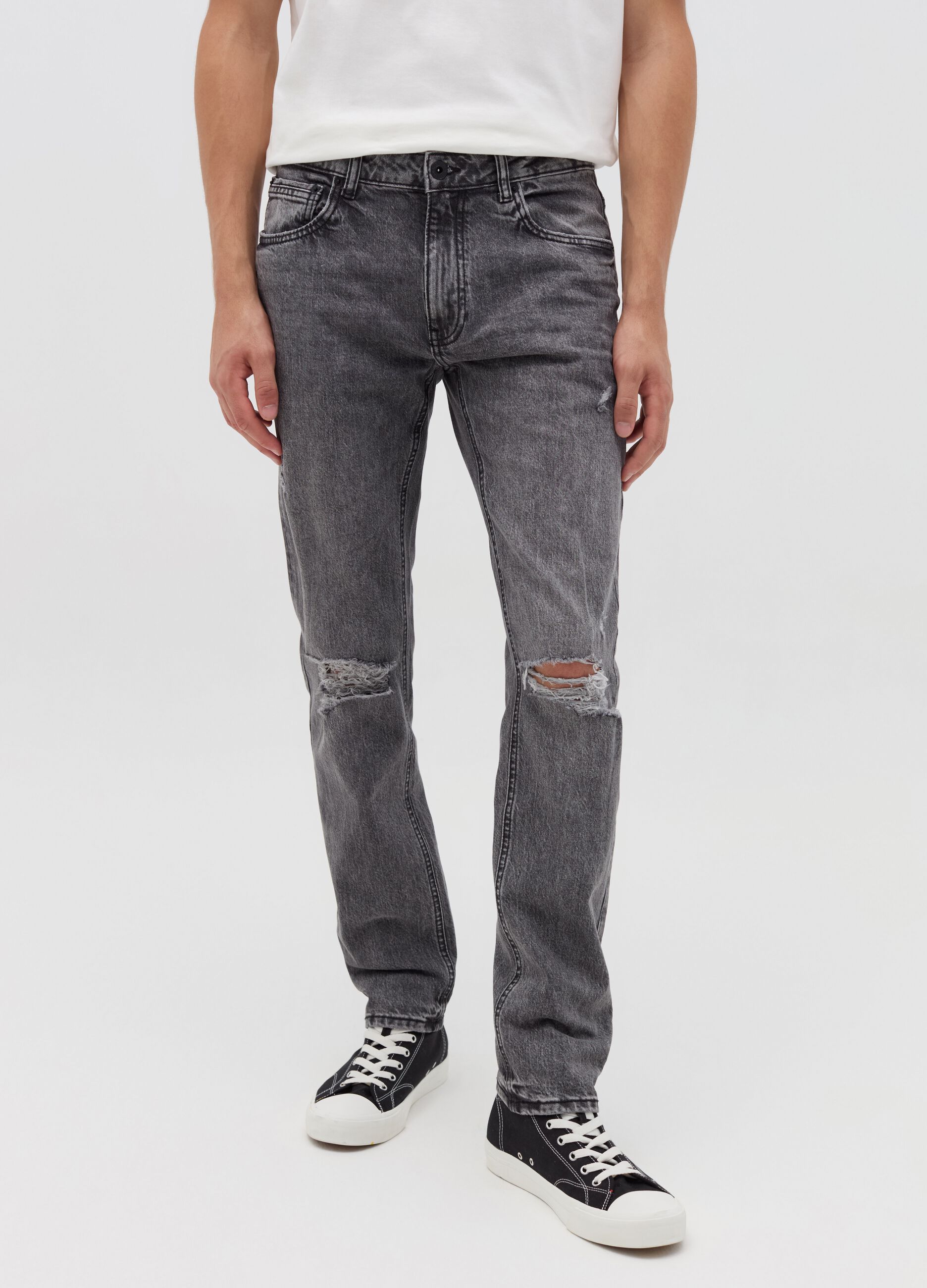 Slim-fit acid-wash jeans with abrasions