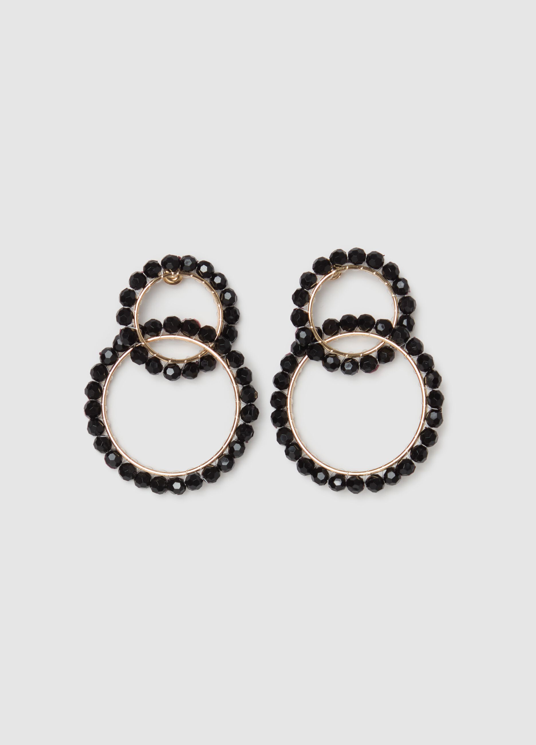 Woven circle earrings with beads