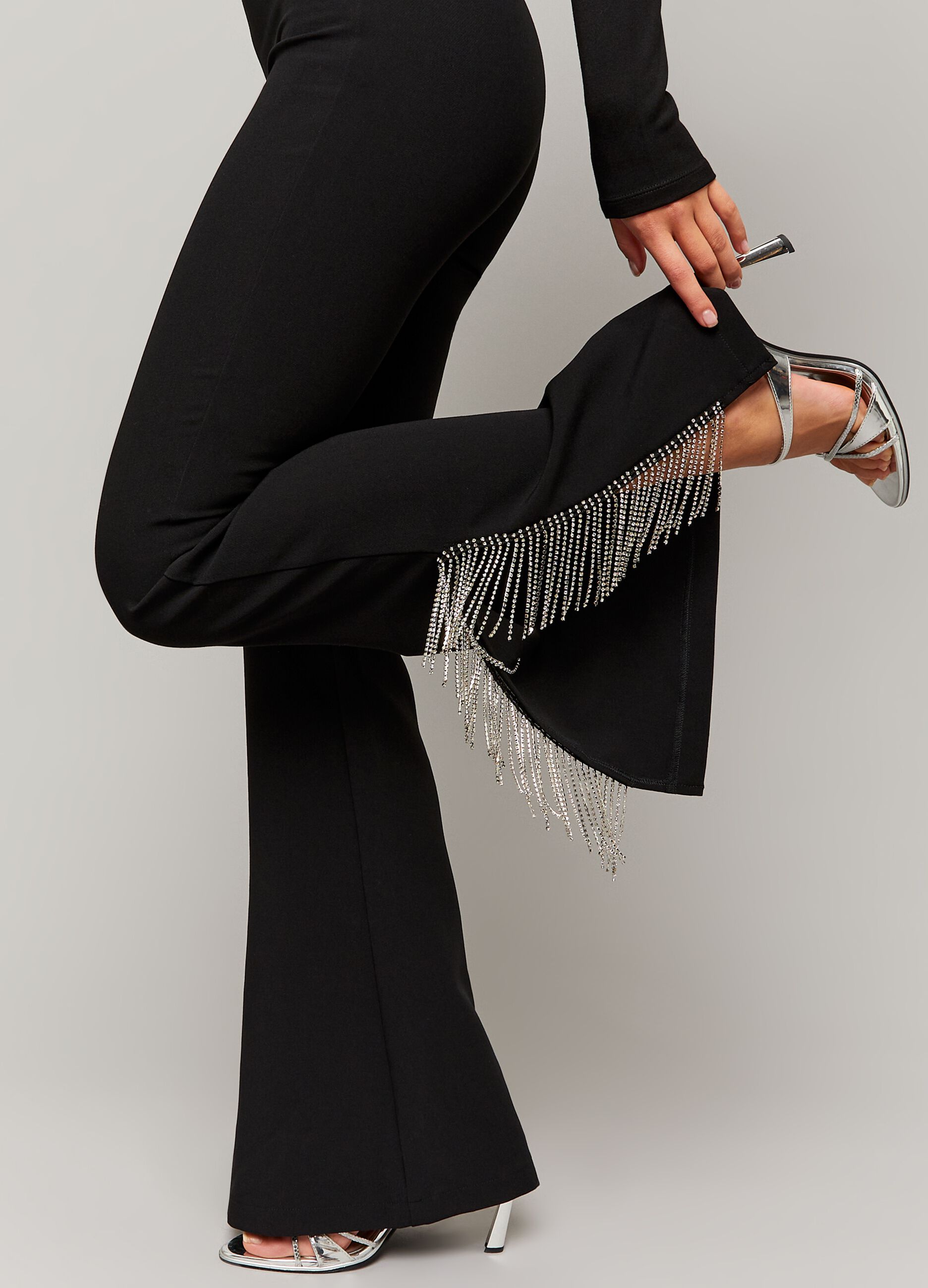 Flare-fit trousers with fringes in diamantés