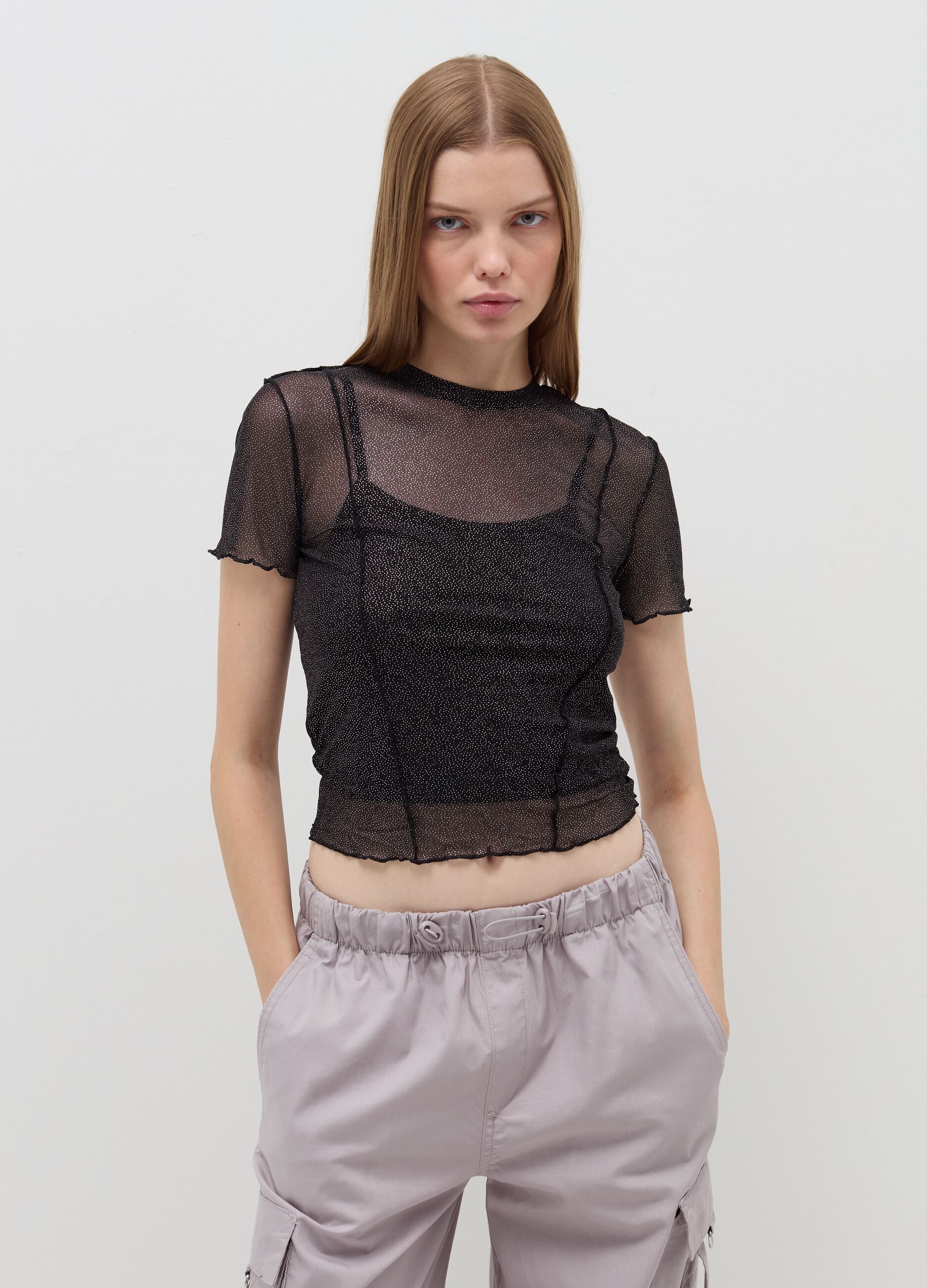 Crop T-shirt in mesh with wavy edging